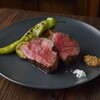 BRIANZA NAGOYA HAERA - 料理写真:炭火で旨味を凝縮。厳選牛のジューシーな赤身と、炭の香ばしさを味わう至福の逸品。