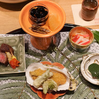 御幸町 田がわ - 鳥羽市浦村牡蠣フライ、たらの芽、ふきのとう、ランプ肉、三陸のあわび、紅白かきなます、黒豆、たつくり、数の子