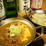 Shimpachi - 定番！美味しいお酒と共に、、「もつ煮こみ」378円「あさり酒蒸し」294円