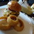 ダグズ・バーガー - 料理写真:Doug's Do W.A.T. Cheese Burgerの溶岩焼き オニオンリングセット