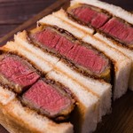 Ginza Sando - 特撰国産牛ヘレカツサンド　揚げたての牛ヘレカツを自家製デミグラスソースで仕上げた絶妙なミディアムレアの極上サンドです。