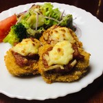 Grilled fillet cutlet with tomato sauce and cheese