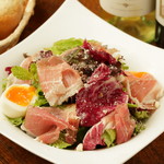 Caesar salad with Prosciutto and soft-boiled egg from Parma, Italy