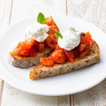 Tomato bruschetta with homemade ricotta cheese