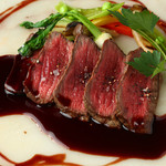 Grilliata of domestic beef arm with rich red wine sauce and warm vegetables