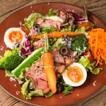 Nicoise salad set with grilled vegetables and bacon