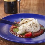 Melting buffalo mozzarella caprese