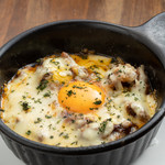 Kobe beef tendon Braised beef tendon topped with melted cheese and soft-boiled egg