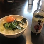 中華そば 四つ葉 - 玉子かけごはん
      
      玉子かけごはん 金笛の専用醤油でいただく