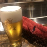 温石 - エビスの生ビール。お手拭きはPOLO