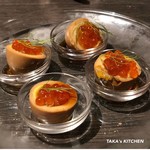 Soft-boiled egg topped with raw sea urchin and salmon roe