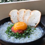 Mentaiko and whitebait topped with Ajillo egg yolk