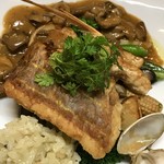 Sauteed fresh fish with porcini mushroom sauce