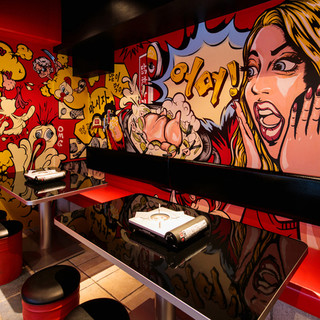 The walls inside the store are mainly red and black with a pop finish.