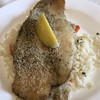 KARDOS - 料理写真:白身魚のグリルがピラフの上に乗った料理