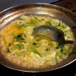 もつ焼もつ鍋しましょく - もつ鍋後のおじや（卵かけ）