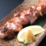 Grilled Yamahara young chicken on a single iron skewer