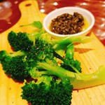 Freshly boiled broccoli with tapenade sauce