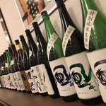 Shunsai Nanami - 店内、日本酒の空瓶がたくさん並んでた
