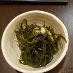 居酒屋　いもんこ - お通し  茎わかめとさつま揚げの炒めもの