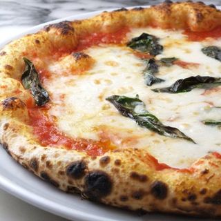 [Authentic Neapolitan pizza baked in a stone oven. Try our signature pizza! ]