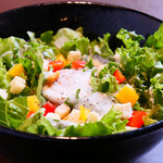 Caesar salad topped with warm egg