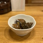 さかなの秀彩 - お通し(黒バイ貝のうま煮)