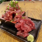 中落ち100円の店 まぐろんち - 名物・中落ち。