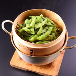 Steamed edamame in bamboo steamer