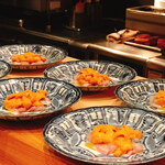 やまぐち - 甘鯛にエクストラバージンオリーブオイルがかけられて、上には雲丹がトッピング