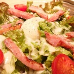 Caesar salad with egg and bacon