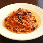 Spaghetti with anchovies and olives in tomato sauce