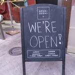 Azuki Sushi - 店舗前看板。改装中はこれで店名を確認。