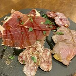 Assorted freshly cut jamon serrano and ham