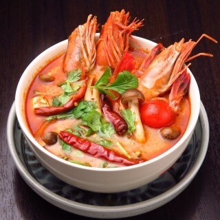 Flavorful "Tom Yum Goong" with whole shrimp head in each plate