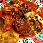 Beef cheeks and pork thighs stew with tomatoes