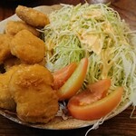 居酒屋 さくら - お通しのチキンナゲット