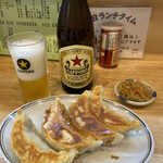 昇龍 - 餃子500円と瓶ビール560円です