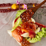 Fukui salmon and fresh fish carpaccio topped with homemade salmon roe marinated in soy sauce