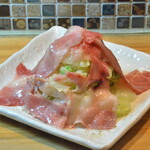 Beef fatty tuna and cabbage salad with olive oil and grated cheese