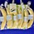 銀座千疋屋 - 料理写真:薄緑色ストライプ模様の紙袋を下敷きにバナナを並べる