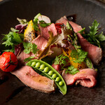 Domestic beef tagliata and colorful vegetable gris