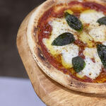 Margherita pizza with fresh basil and mozzarella