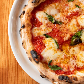 The dough is aged for 30 hours and baked in a custom-made wood-fired oven.