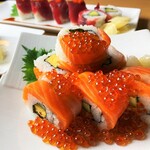 Salmon roll topped with salmon roe