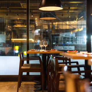 Enjoy a wonderful time with a glass of wine at a table overlooking the street...