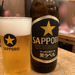 初恋屋 - 瓶ビール（大）600円　先代の頃から黒ラベル...、人気の店なのに、大瓶が600円は嬉しい...