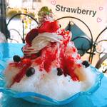 Shaved ice with homemade strawberries simmered in red wine and rich sauce