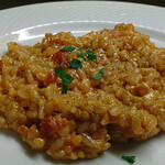 Tomato risotto with mushrooms and onions