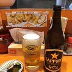 松楽 - とりあえず瓶ビール中瓶が530円にお通しの酢蛸。